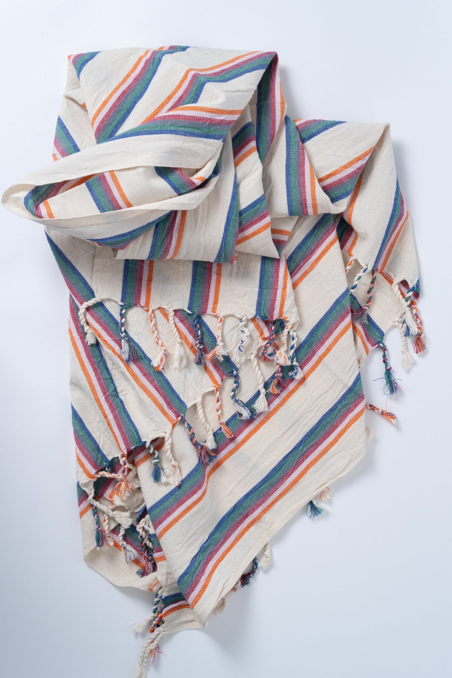 Striped fabric bag with colorful patterns on a white background