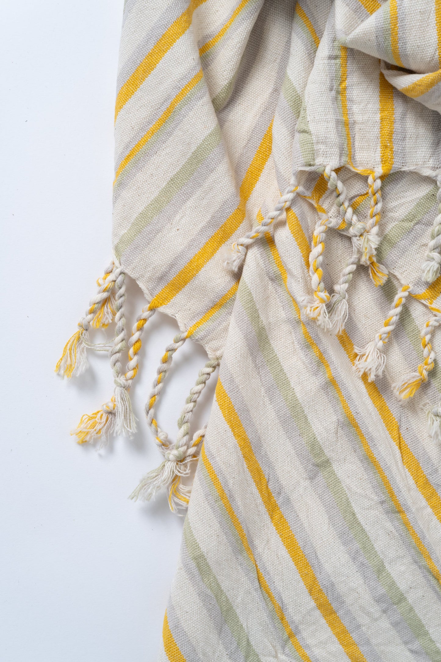 Striped fabric with yellow and gray pattern on a white background