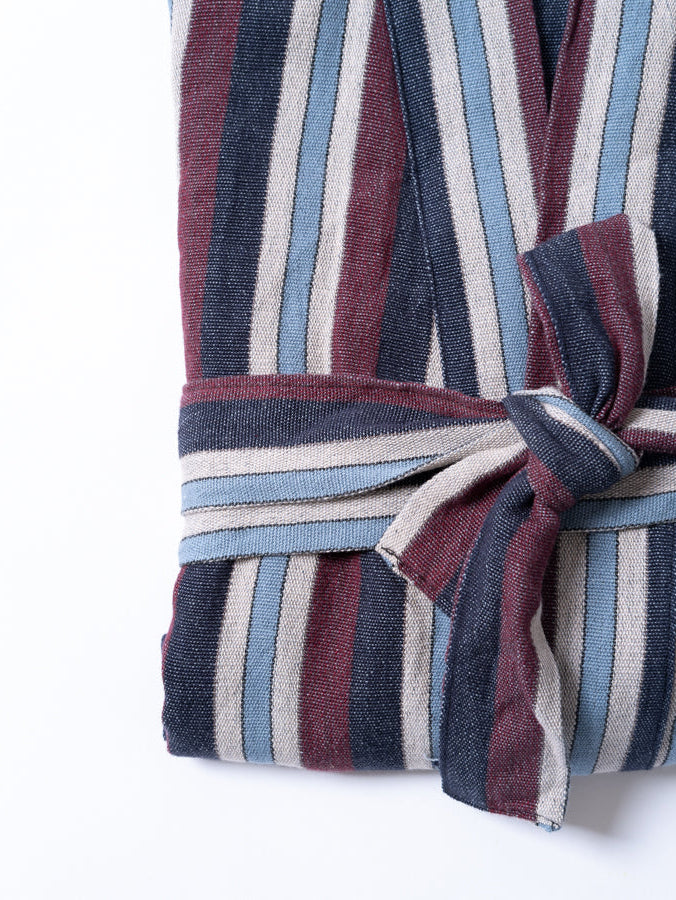 Striped robe with a tie on a white background