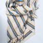 Striped fabric with blue and yellow patterns on a white background