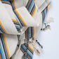Striped fabric bundles on a white background