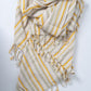 Striped scarf with yellow and white colors on a white background
