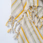 Striped fabric with yellow and gray pattern on a white background
