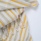 Textile with yellow and beige stripes on a white background